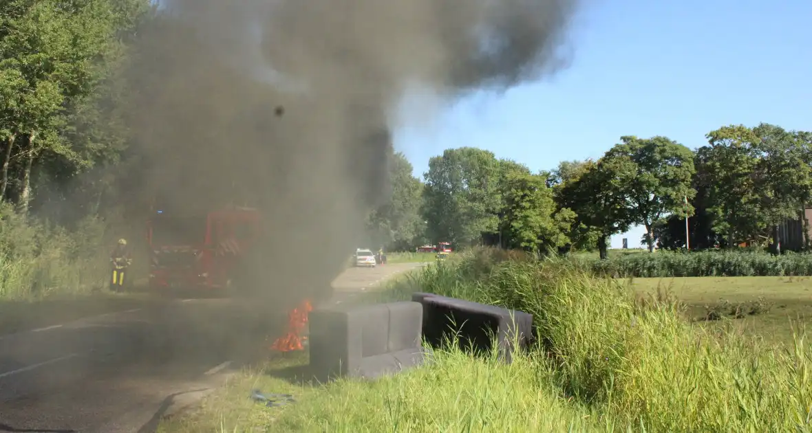 Vouwwagen vat vlam tijdens rijden - Foto 13