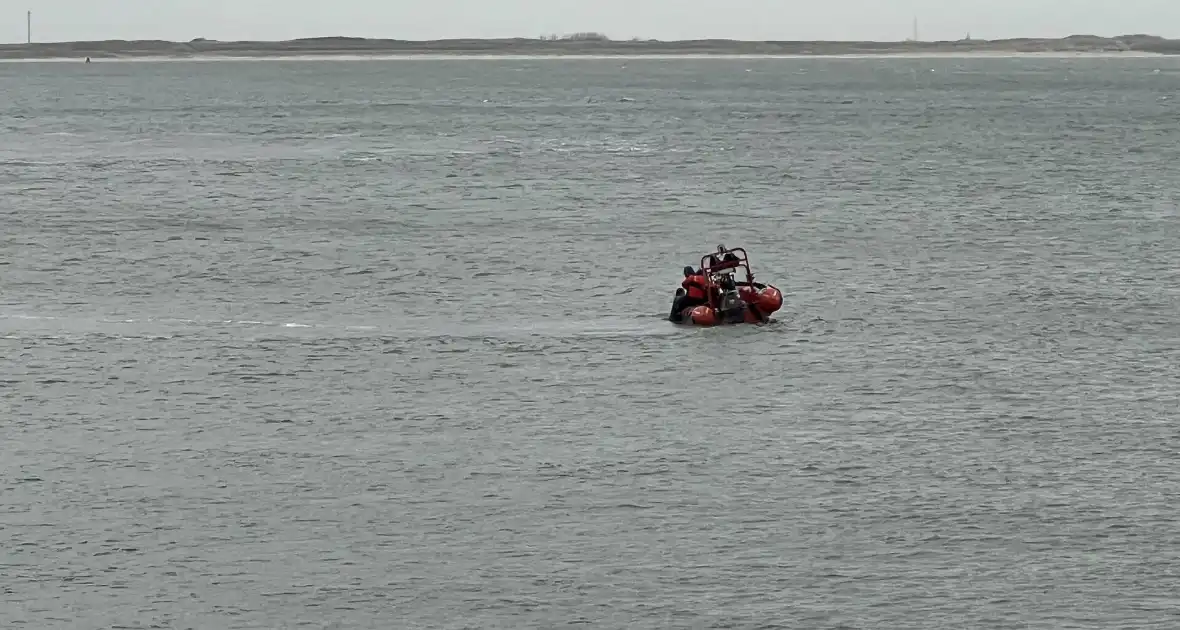 Vrouw uit het water gehaald - Foto 1