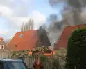 Tuinhuis vat vlam