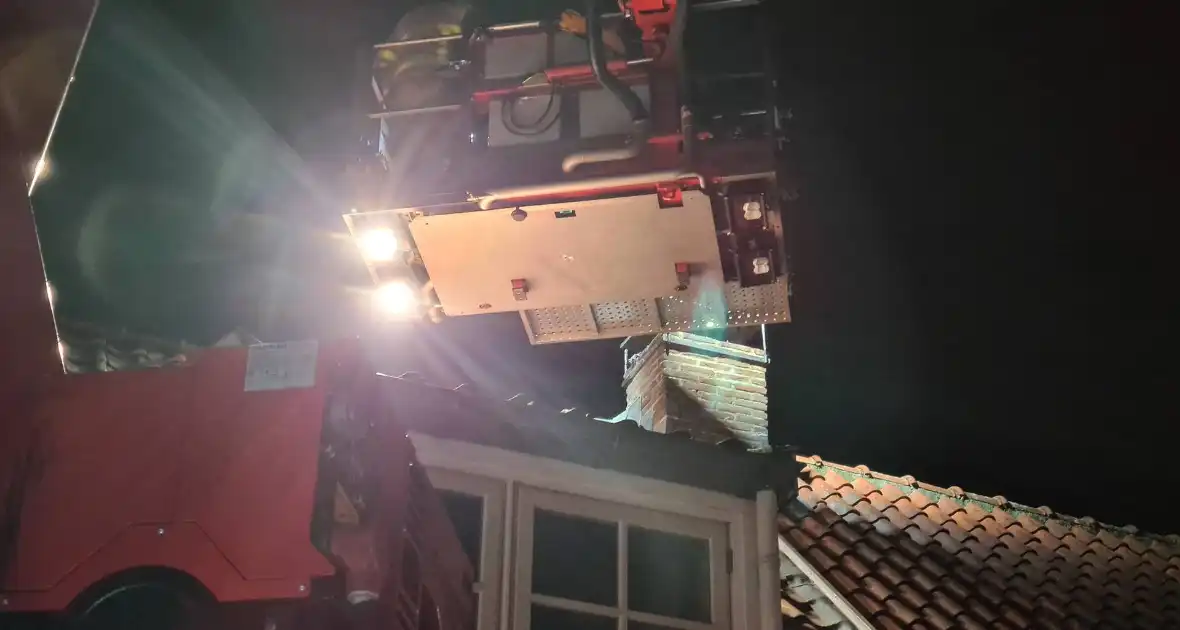 Schoorsteenbrand bij woning in binnenstad - Foto 3