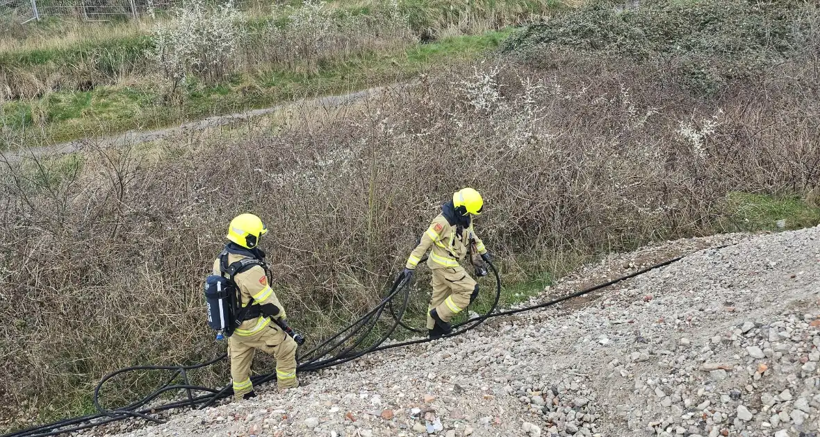 Brandstichting in bouwafval - Foto 4