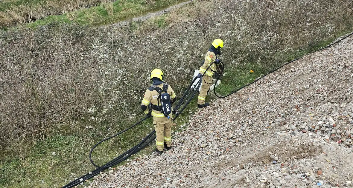 Brandstichting in bouwafval - Foto 5