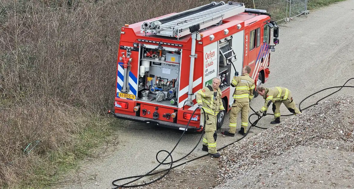 Brandstichting in bouwafval - Foto 6