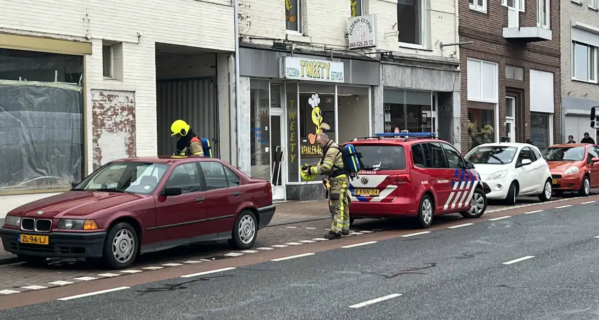 Politie en brandweer doen onderzoek in pand - Foto 5