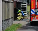 Brand in muur van schuur