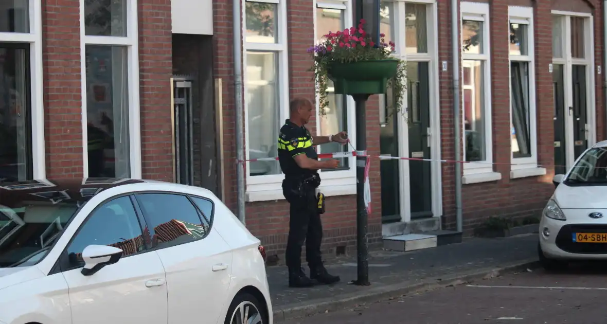 Overleden vrouw aangetroffen in woning, twee mannen aangehouden - Foto 6