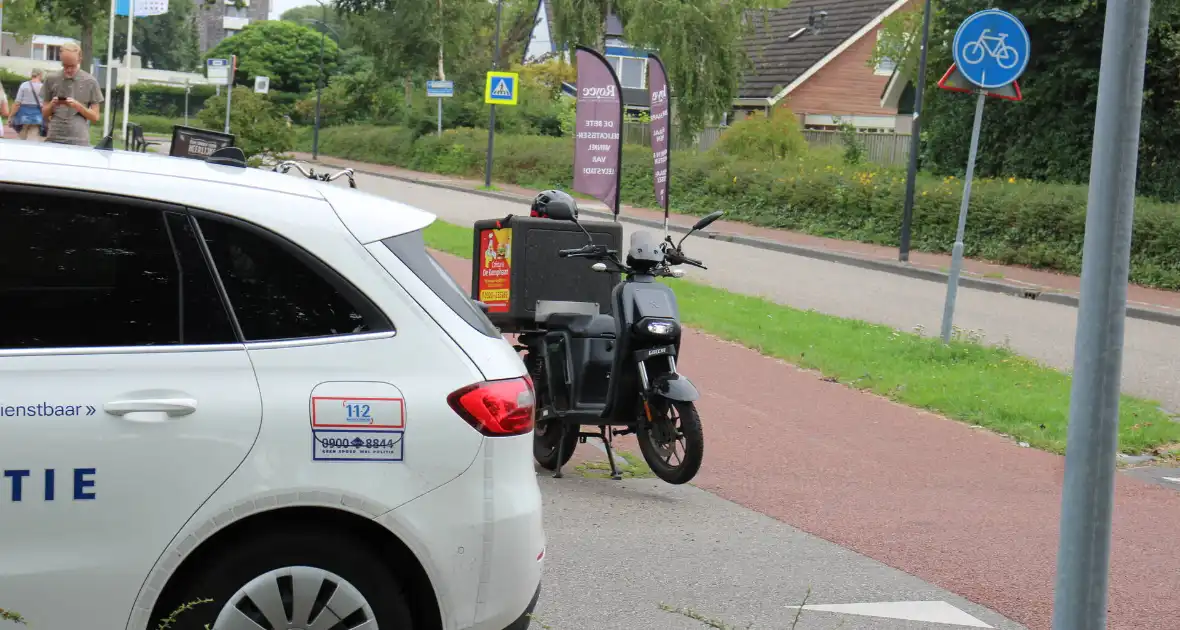 Schade bij botsing tussen auto en scooter - Foto 6