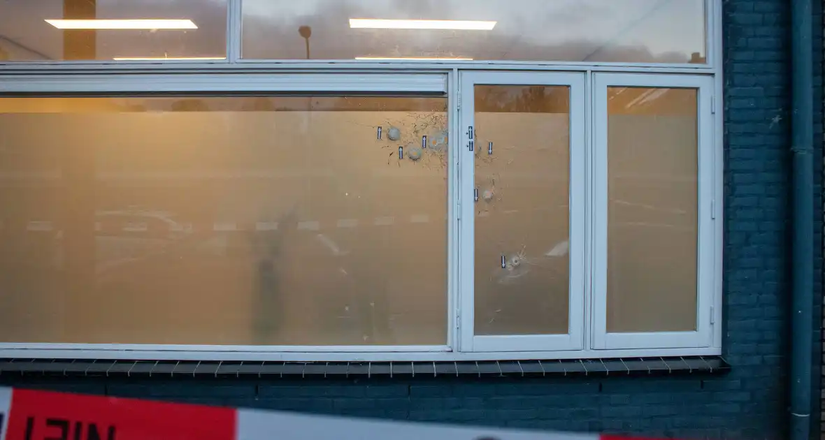 Kogelgaten aangetroffen in bedrijfspand - Foto 7
