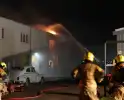 Grote schade door uitslaande brand in bedrijfspand