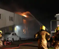 Grote schade door uitslaande brand in bedrijfspand