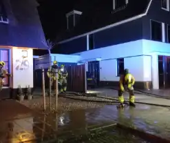 Afvalbrand bij woning