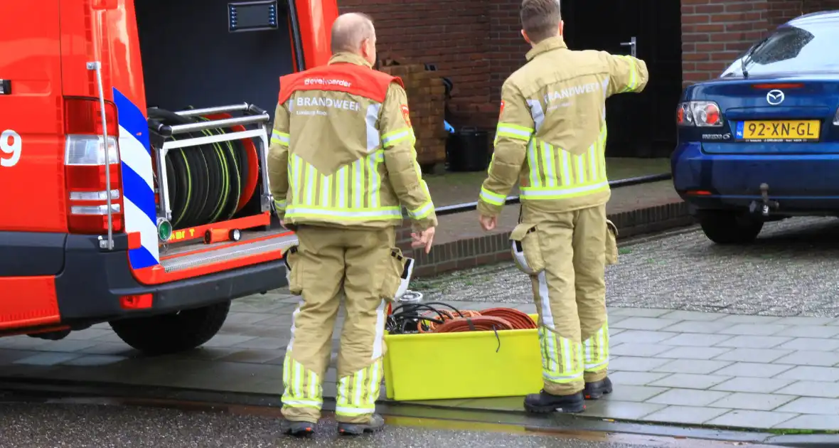 Brandweer pompt ondergelopen kelder leeg - Foto 11