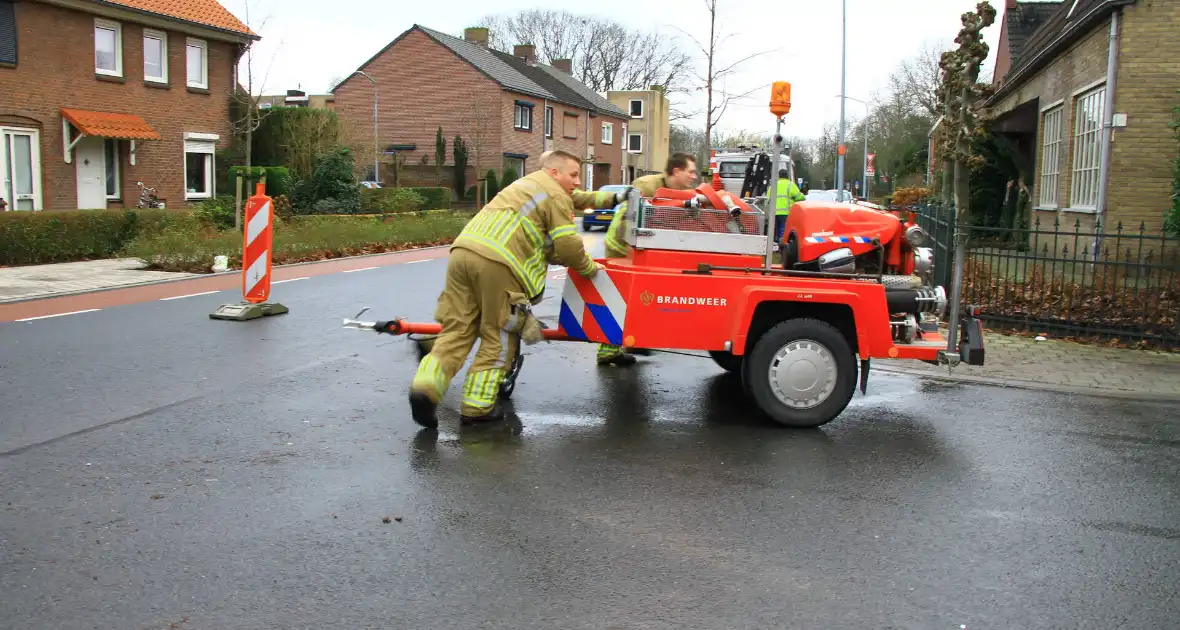 Straat onder water na overstroming riool - Foto 10