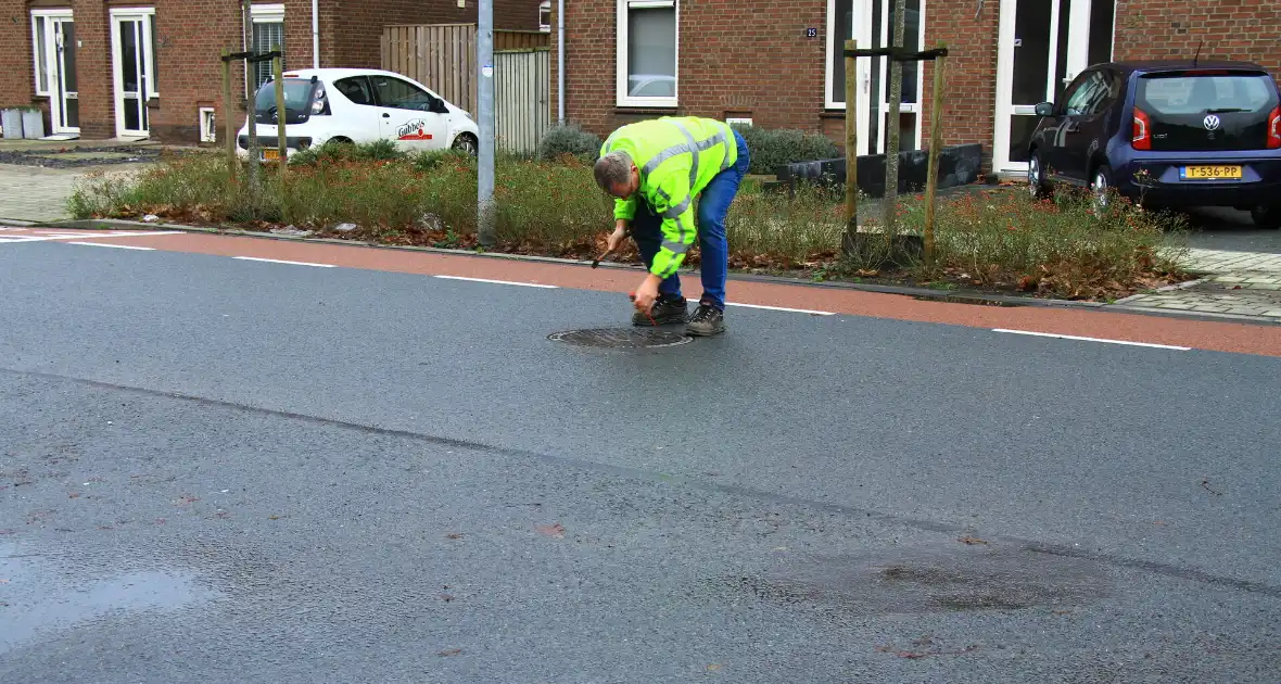 Straat onder water na overstroming riool - Foto 17