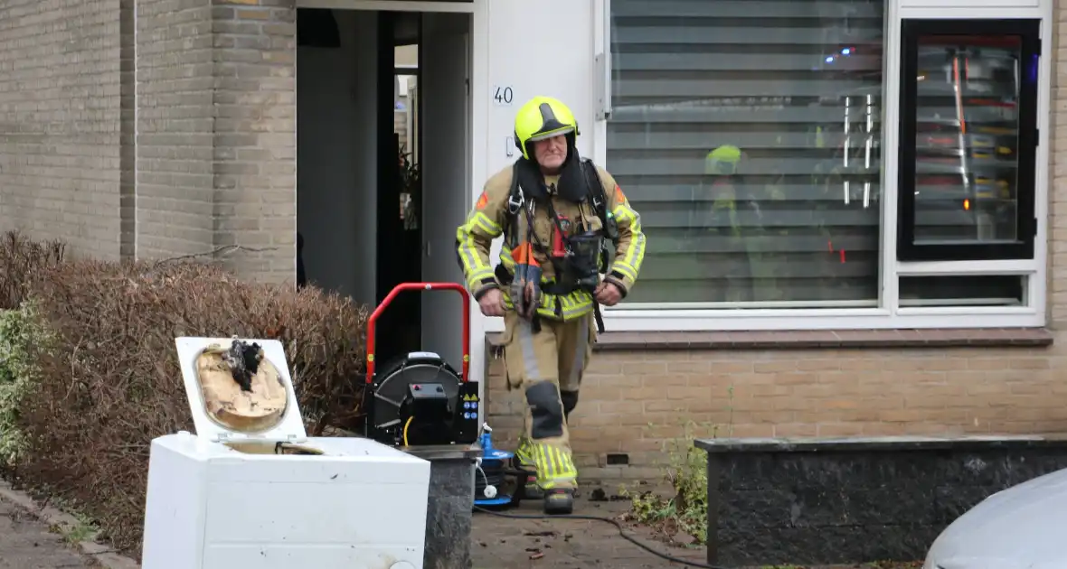 Droger vliegt in brand in woning - Foto 6