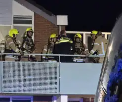 Rookontwikkeling bij brand op eerste verdieping van woning