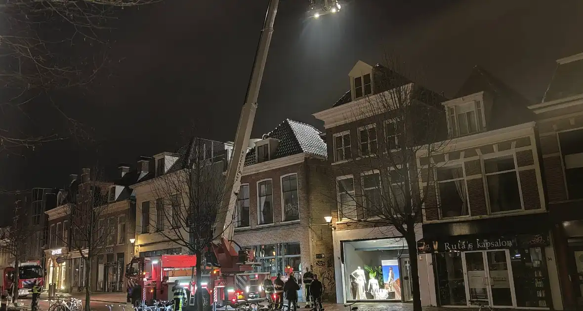 Zoekactie naar persoon op dak van gebouw - Foto 10