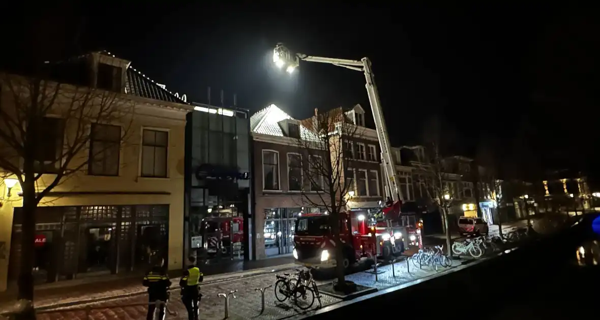 Zoekactie naar persoon op dak van gebouw - Foto 8