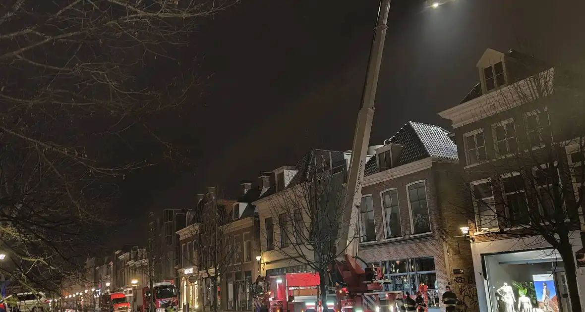 Zoekactie naar persoon op dak van gebouw - Foto 9