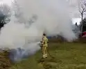 Bult met tuinafval in brand