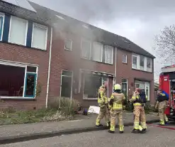 Rookontwikkeling bij brand in keuken van woning