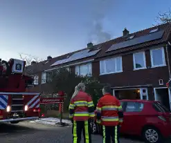 Rookontwikkeling bij brand op zolder van woning