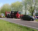 Vuilniswagen botst tegen auto