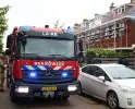 Brand in dak van woning snel onder controle