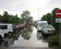 Stroomuitval en overstromingen door hevige regenval