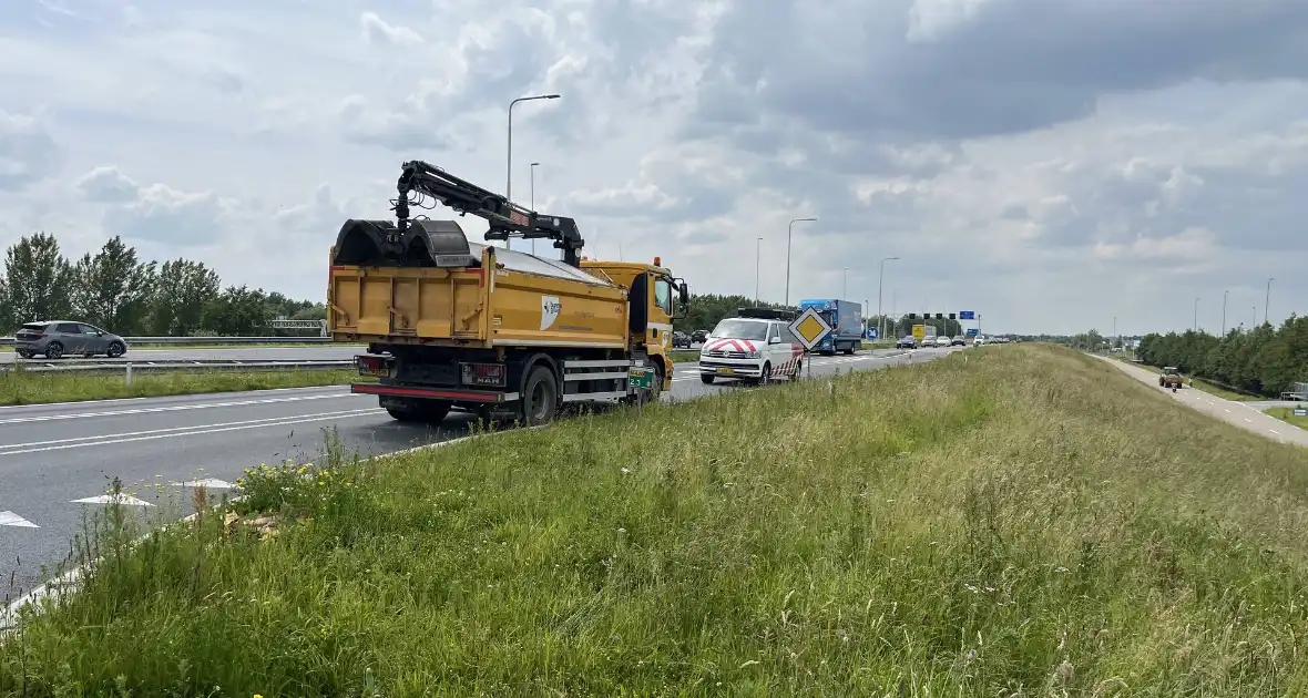 Auto te water na frontale aanrijding met vrachtwagen - Foto 1