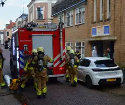 Appartement vol rook door keukenbrand