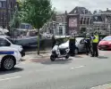 Scooterrijder botst tegen openslaand portier