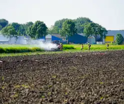 Grote rookwolken door brand in tractor