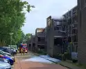 Brandweer ingezet voor brand in dak van portiek