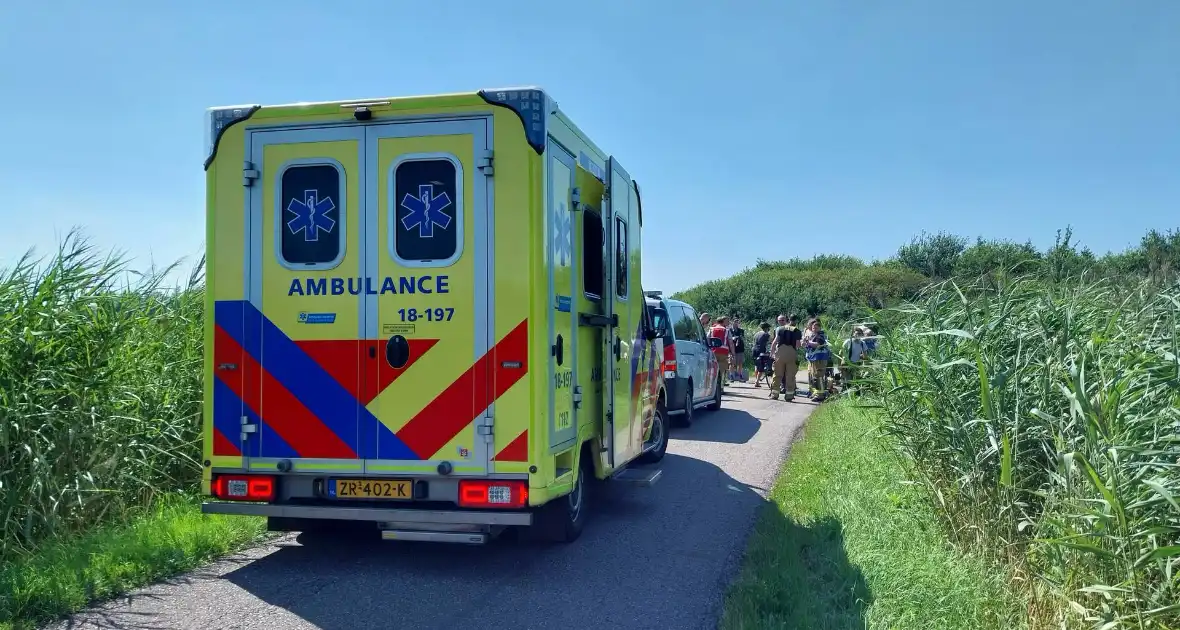 Persoon op scootmobiel belandt in water