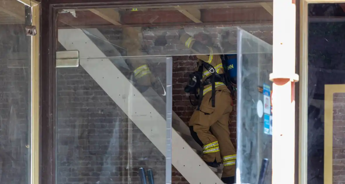 Brandende bouwmaterialen in binnenstad - Foto 5