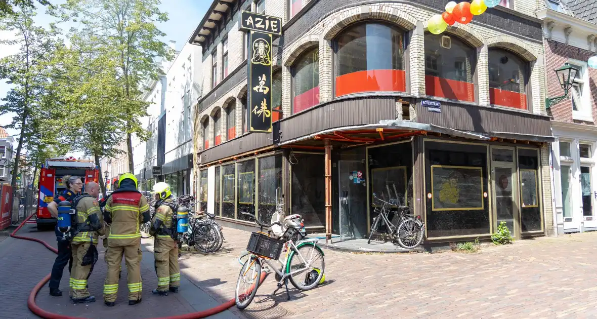 Brandende bouwmaterialen in binnenstad - Foto 9