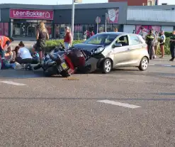 Automobilist en motorrijder met elkaar in botsing