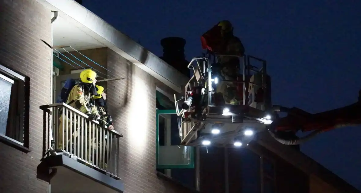 Brandweer ingezet voor brandgeur in portiekflat - Foto 1