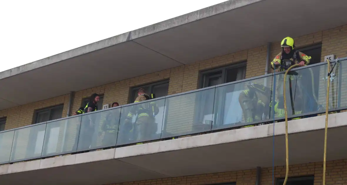 Bewoner gewekt nadat brandweer deur openramt wegens vergeten pannetje - Foto 1