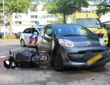 Automobilist schept scooterrijder