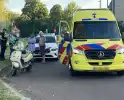 Persoon op scooter onderuit