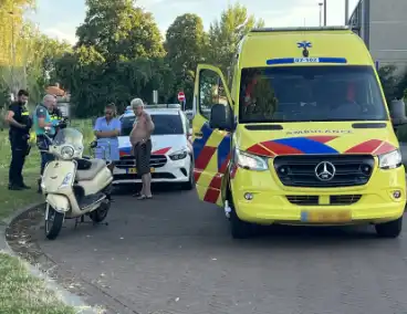 Persoon op scooter onderuit