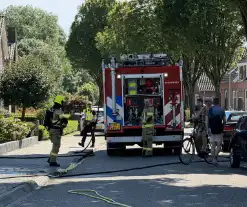 Coniferenhaag bij woning in brand