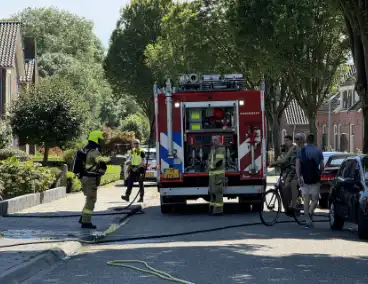 Coniferenhaag bij woning in brand