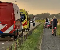 Persoon valt van fiets door wind