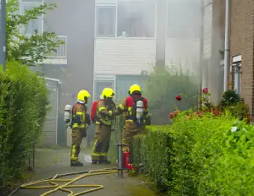 Uitslaande woningbrand door wasmachine