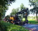 Ongeval met bestelbus en graafmachine