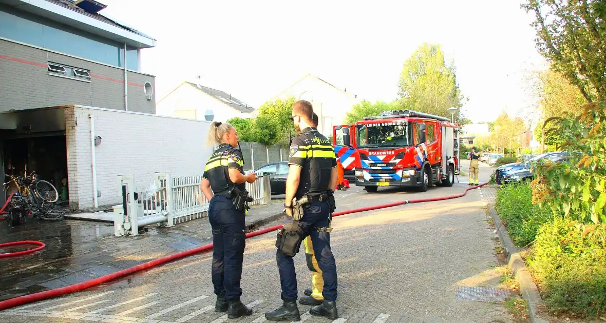 Flinke schade aan garage door scooterbrand - Foto 3