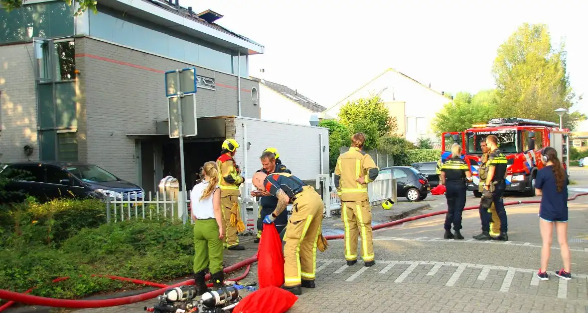 Flinke schade aan garage door scooterbrand - Foto 4